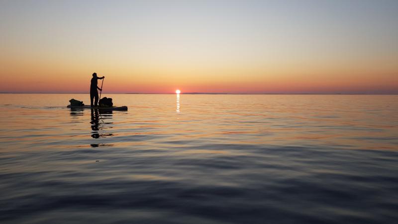 To cross to the middle chain of islands we waited for the calm of evening. The sun dipped below the horizon briefly but it never got dark.